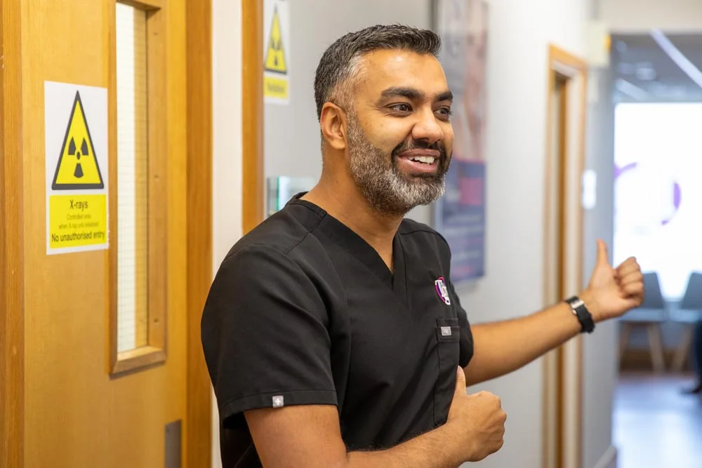 A TG's Dental Suite clinician in the corridor outside the X-ray suite